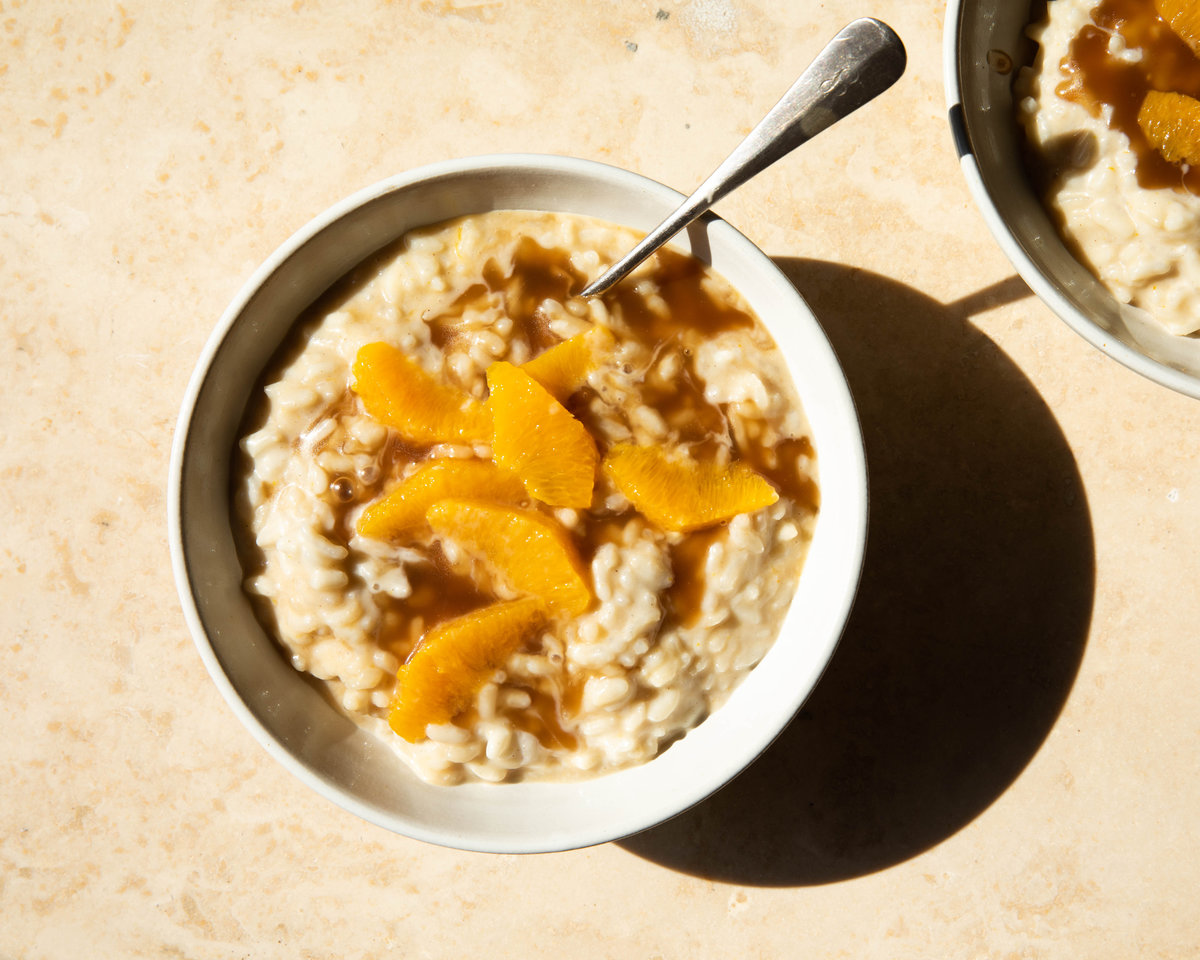 vanilla rice pudding in bowl with orange segments