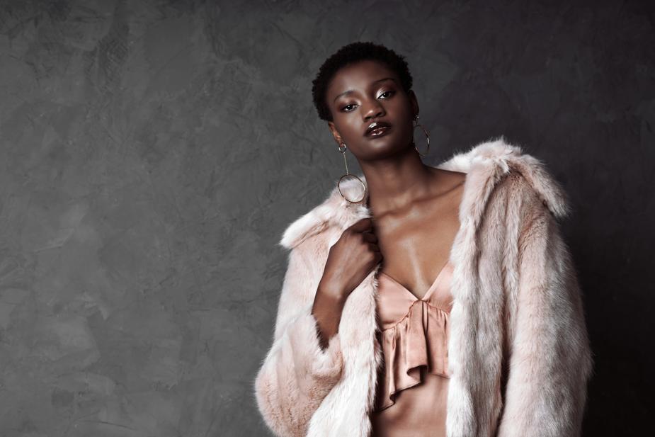 model wearing pink faux fur coat