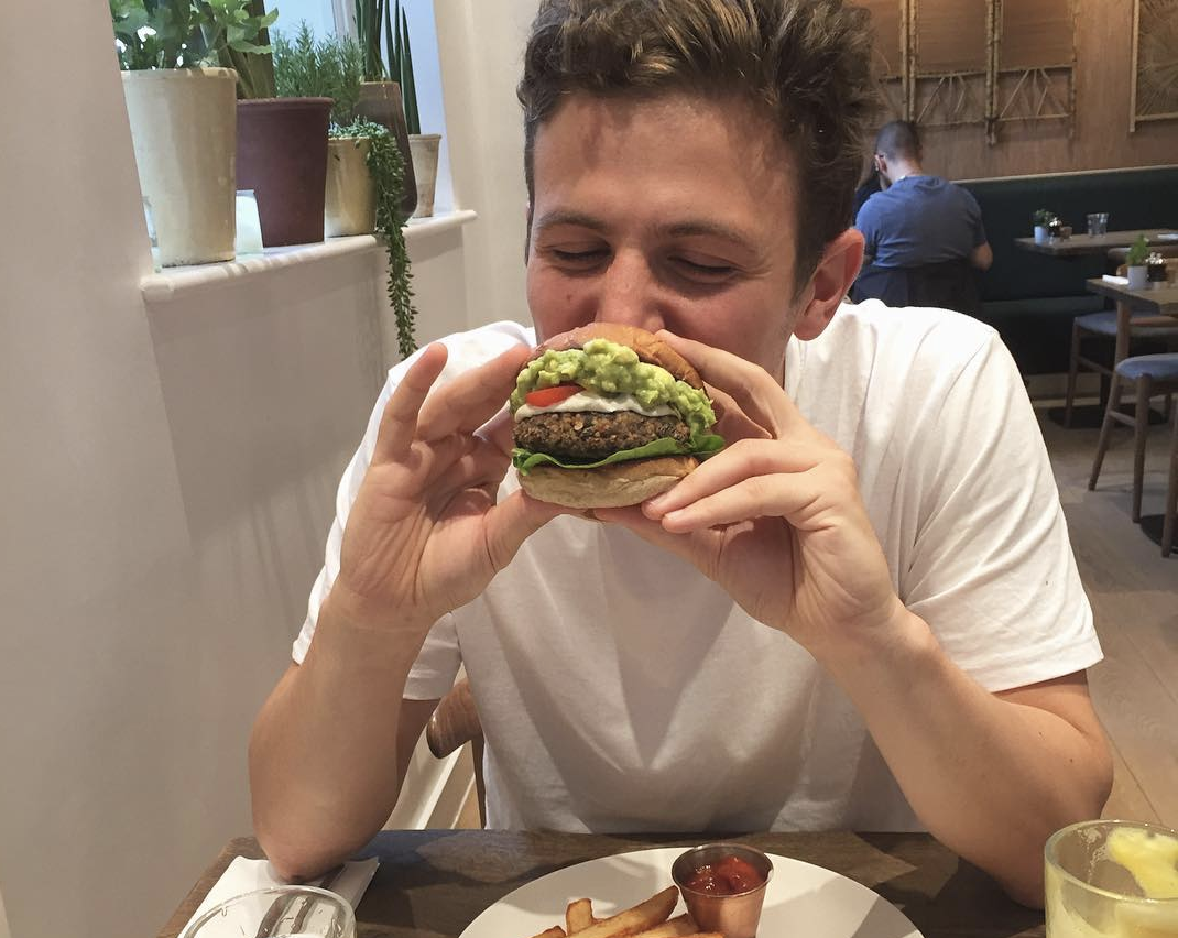 alex eating a burger