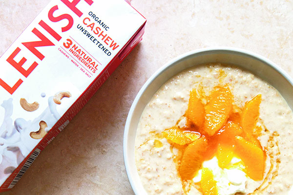 Bowl of porridge oats topped with oranges