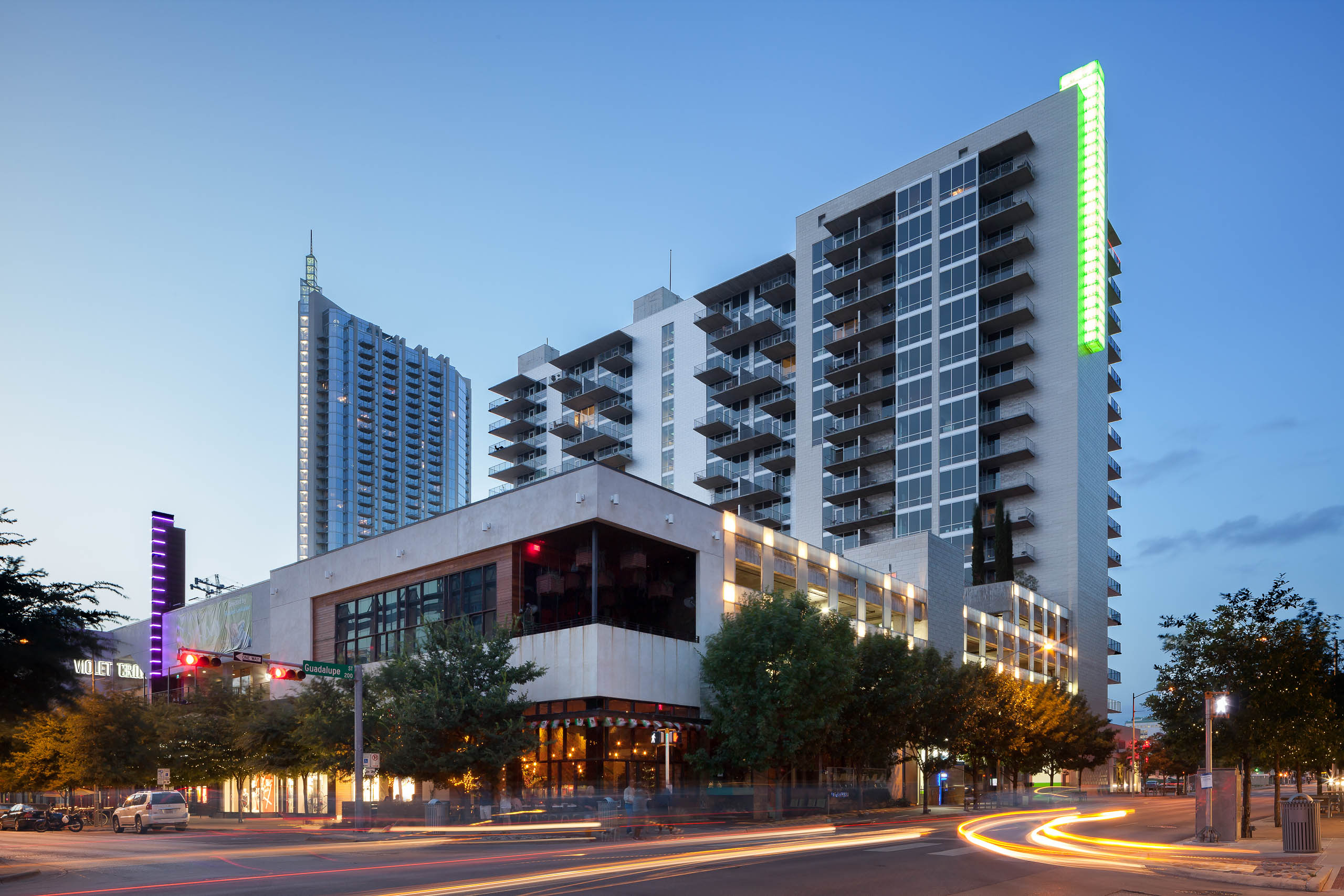 Dusk view of AMLI on 2nd apartment building exterior on street corner