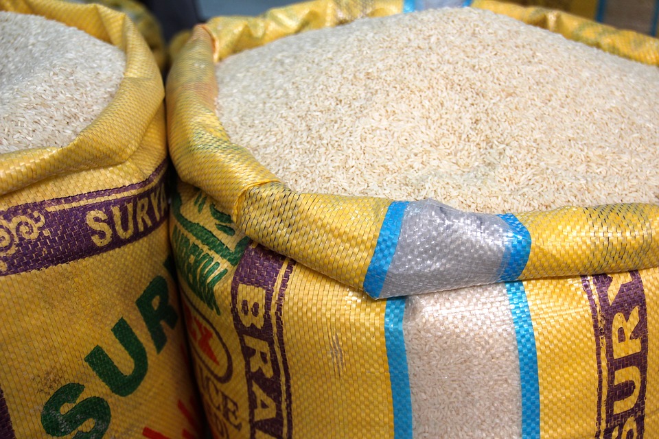 A close up photo of two yellow bags filled to the brim with white rice