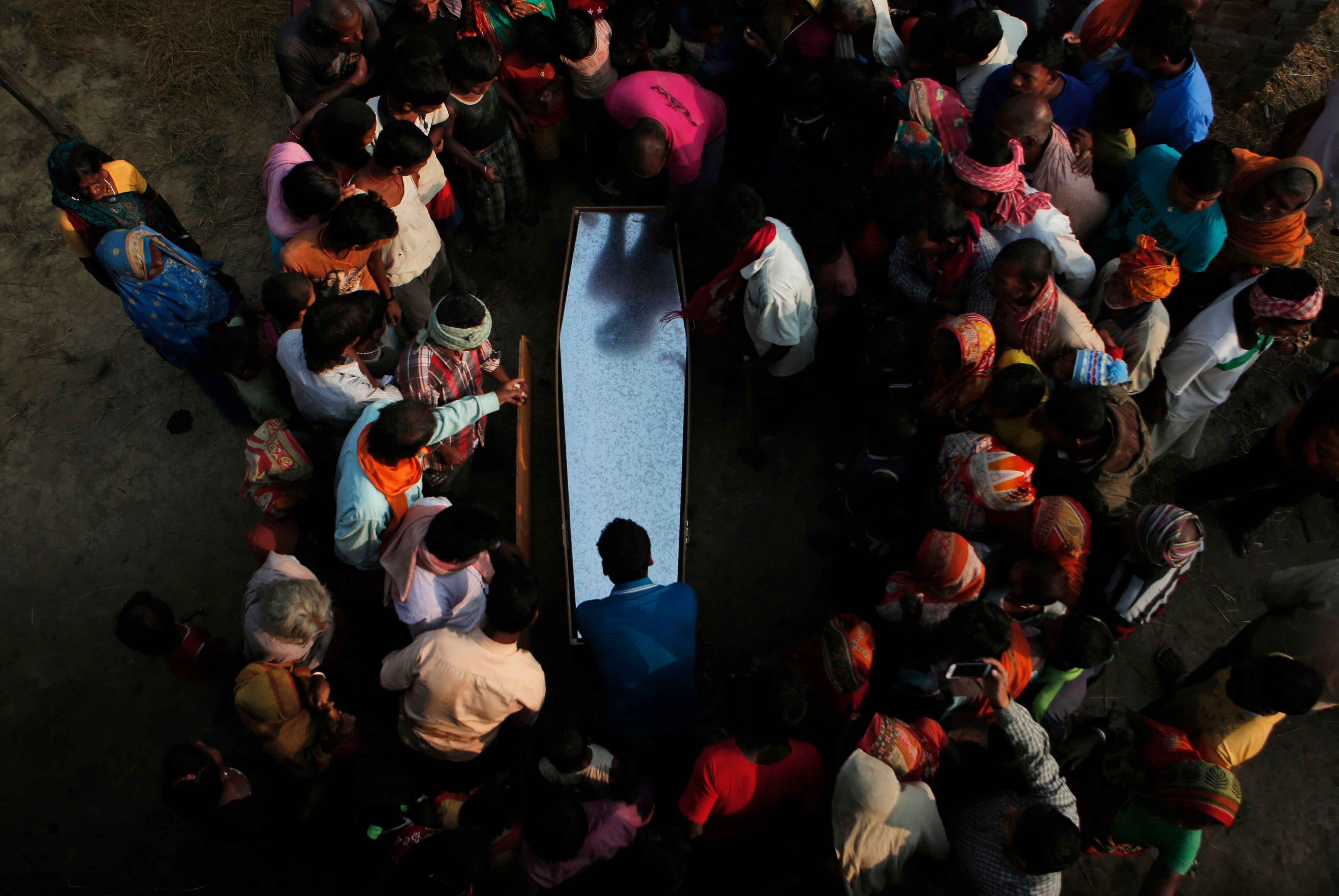 	Mandatory Credit: Photo by Niranjan Shrestha/AP/Shutterstock (7647243a)
Relatives and villagers gather around the coffin of Balkisun Mandal Khatwe at Belhi village, Saptari district of Nepal. Balkisun, who had been working for Habtoor Leighton Group in Qatar for less than a month, died in his sleep. The number of Nepali workers going abroad has more than doubled since the country began promoting foreign labor in recent years: from about 220,000 in 2008 to about 500,000 in 2015. Yet the number of deaths among those workers has risen much faster in the same period. In total, over 5,000 workers from this small country have died working abroad since 2008, more than the number of U.S. troops killed in the Iraq War
Nepal Migrant Deaths - 23 Nov 2016