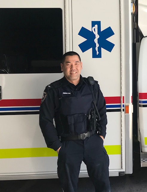 The image shows a person wearing a paramedic uniform.