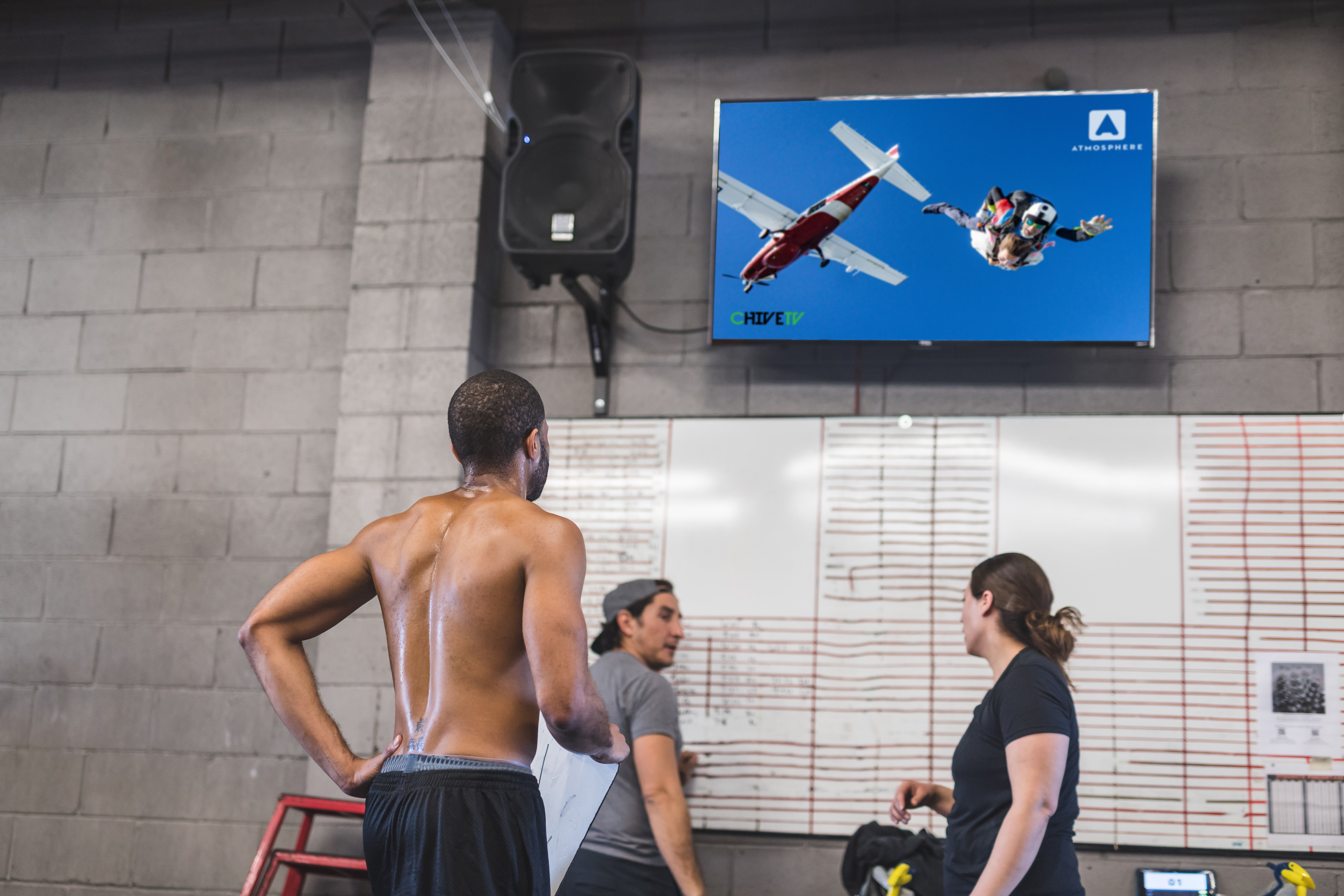 A man receiving physical therapy watching Chive TV to enhance their experience