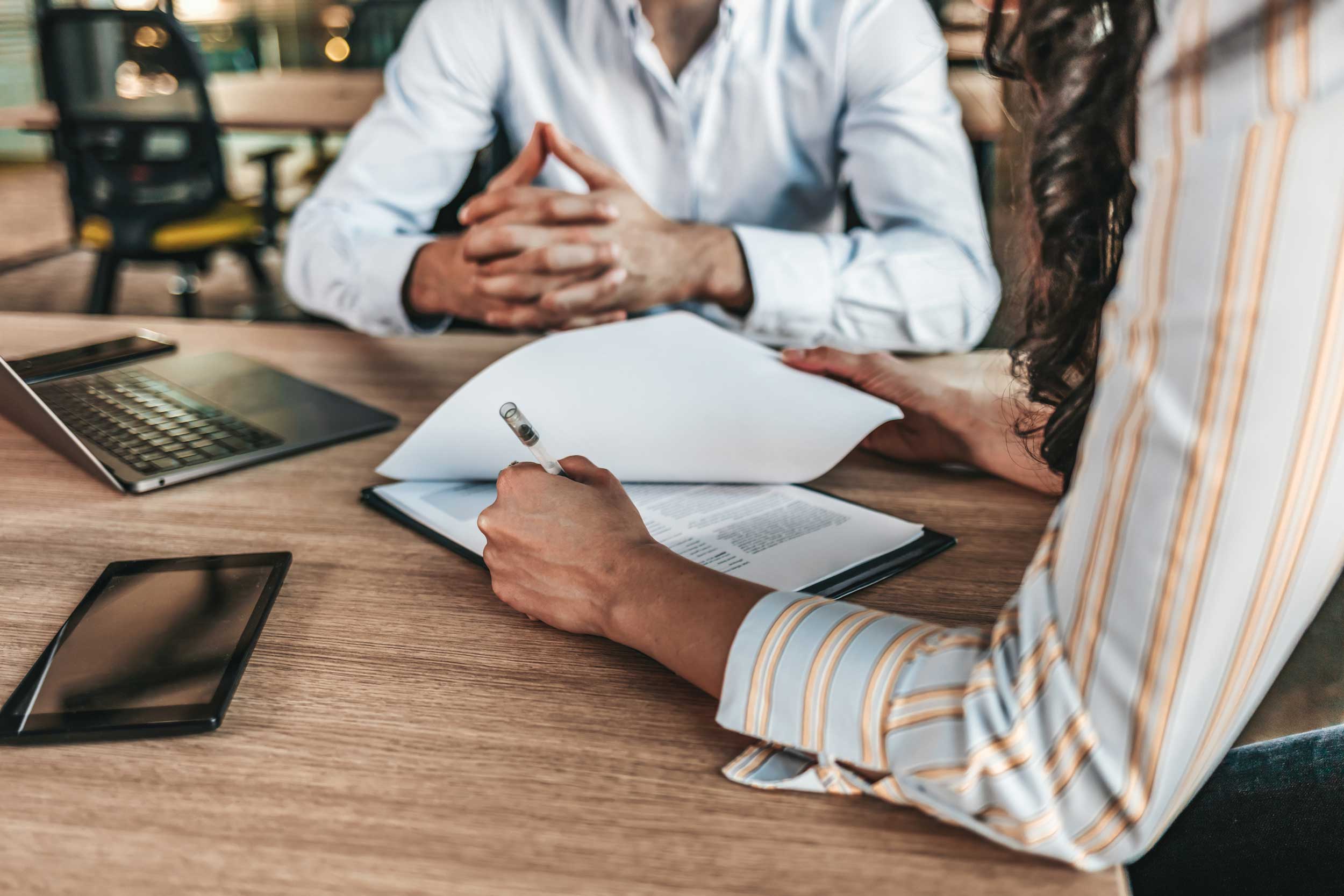 Woman signs contract with her advisor