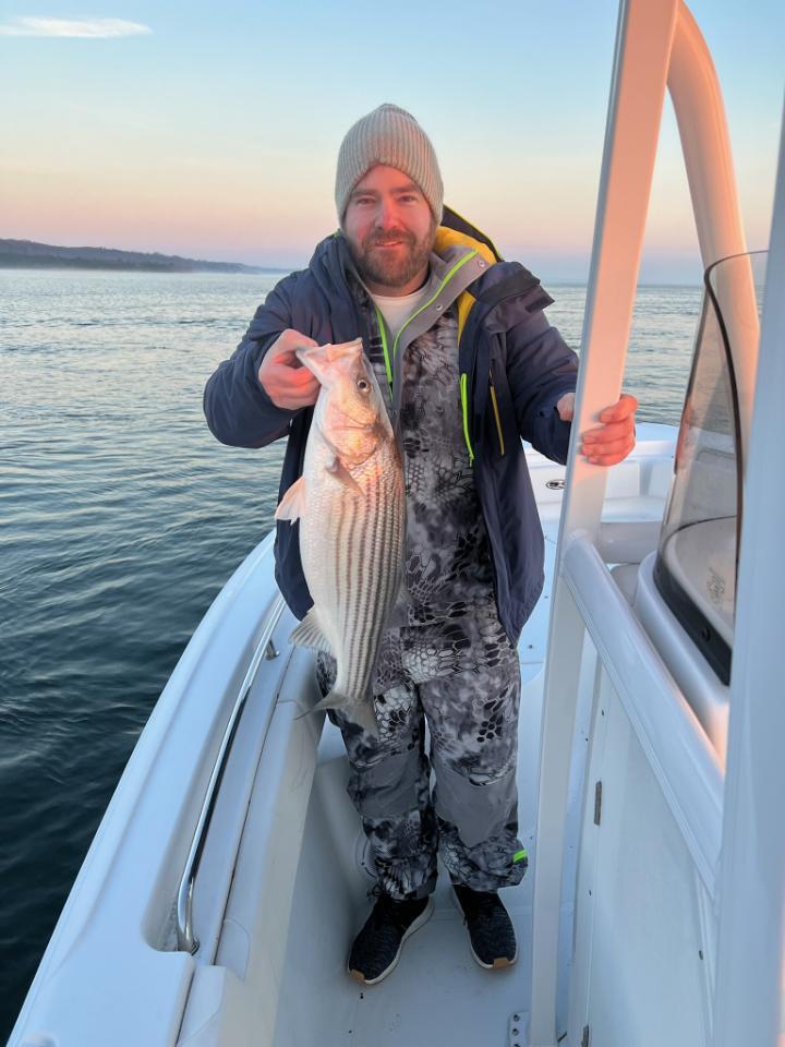 Jeff and the striped bass he caught on Chesapeake Bay