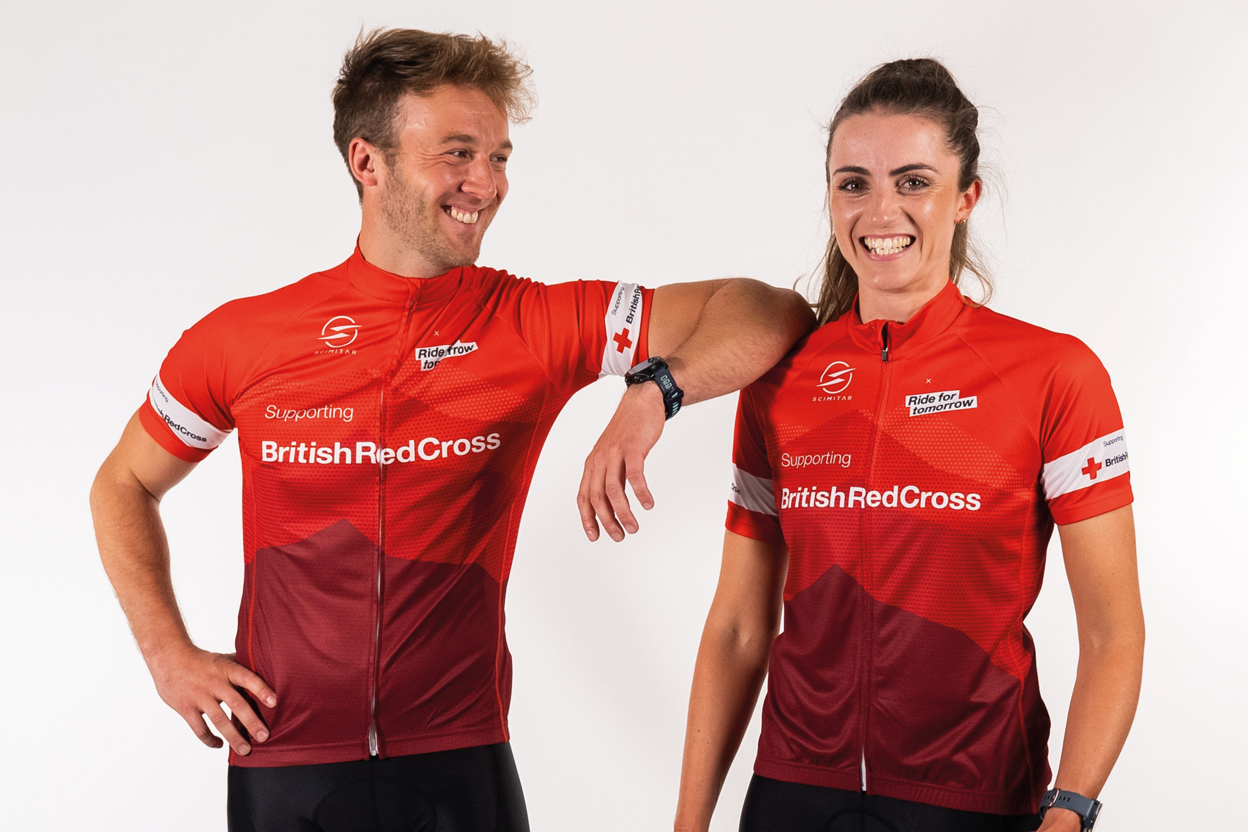 A man and woman wearing red Ride for tomorrow branded cycling jerseys