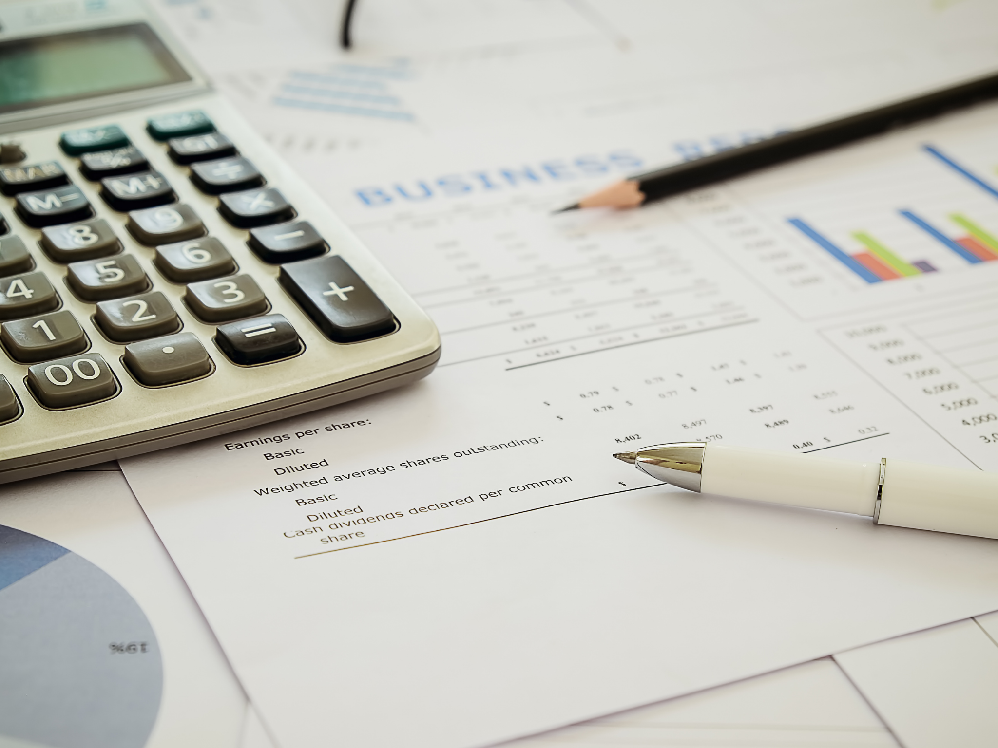 calculator and business cost sheet