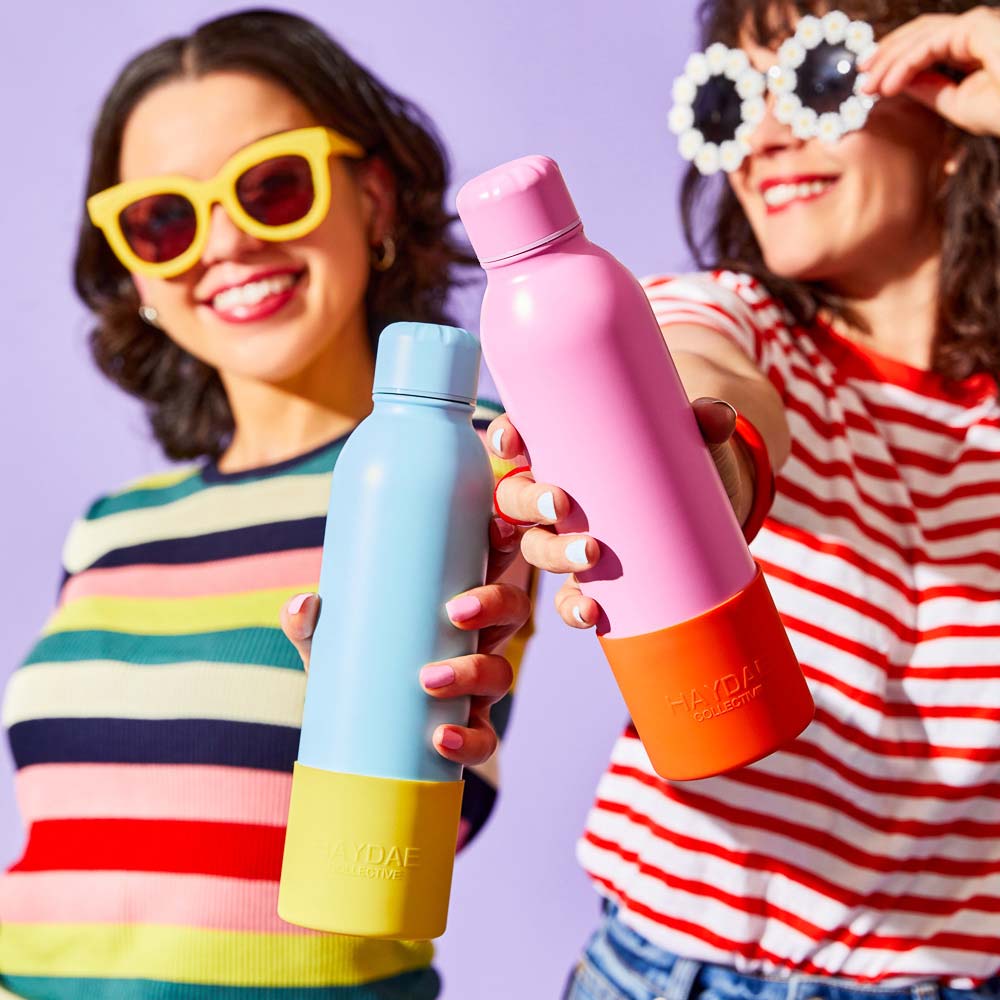 Haydae drink bottles. Two women holding drink bottles in bright clothing and glasses. Your guide to Back to school. 