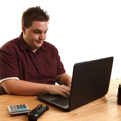 A man uses a computer.