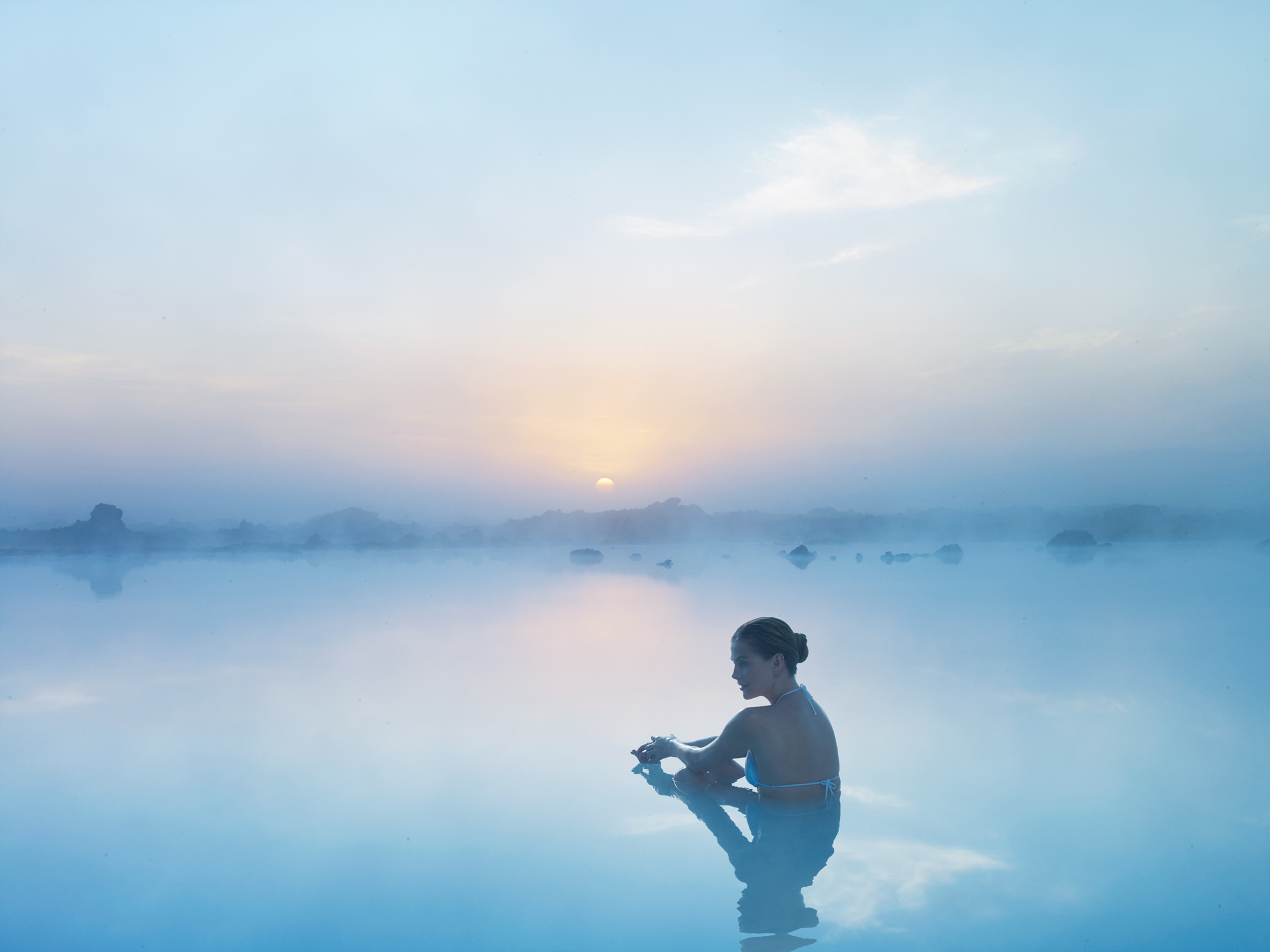 Woman contemplating life at the Blue Lagoon 