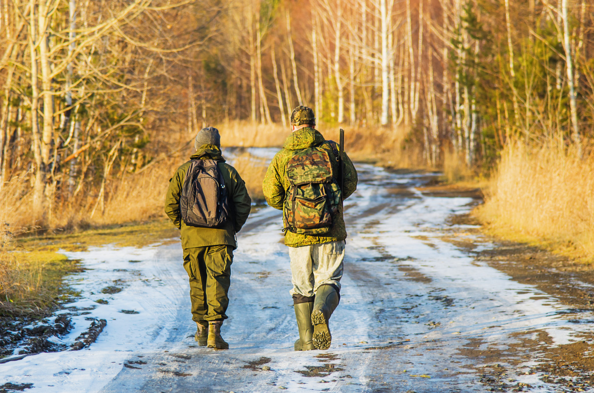 Two hunters on trail