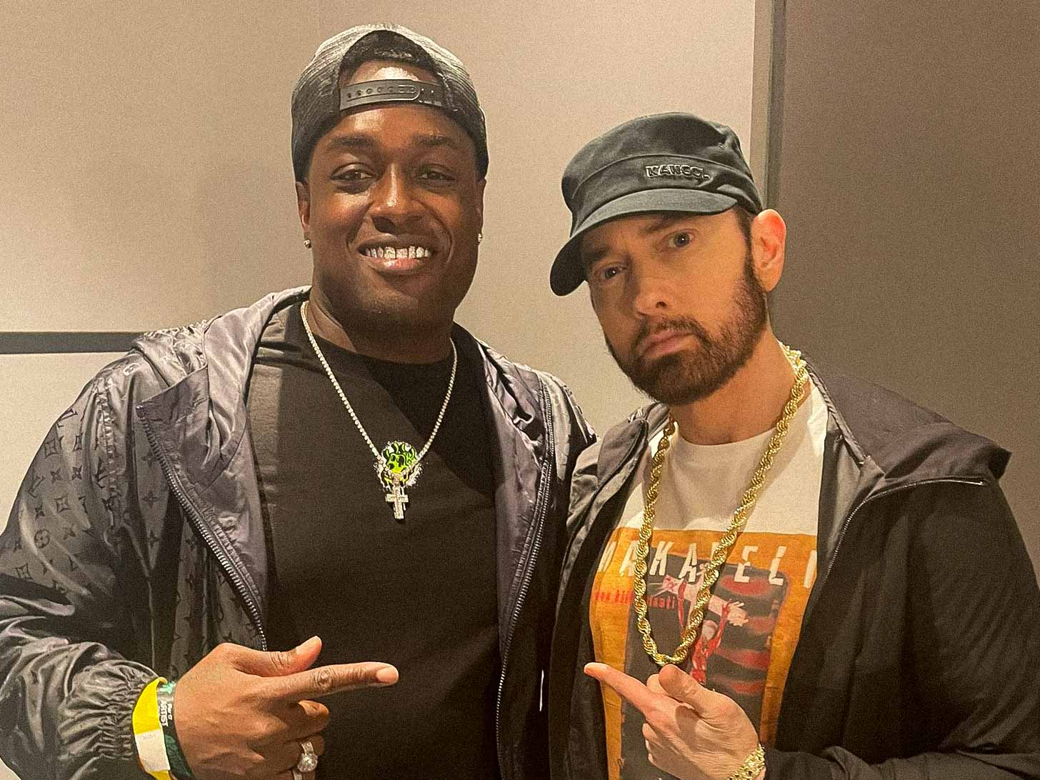 IllaDaProducer standing with rapper and songwriter Eminem at APEFEST in New York, NFT NYC.