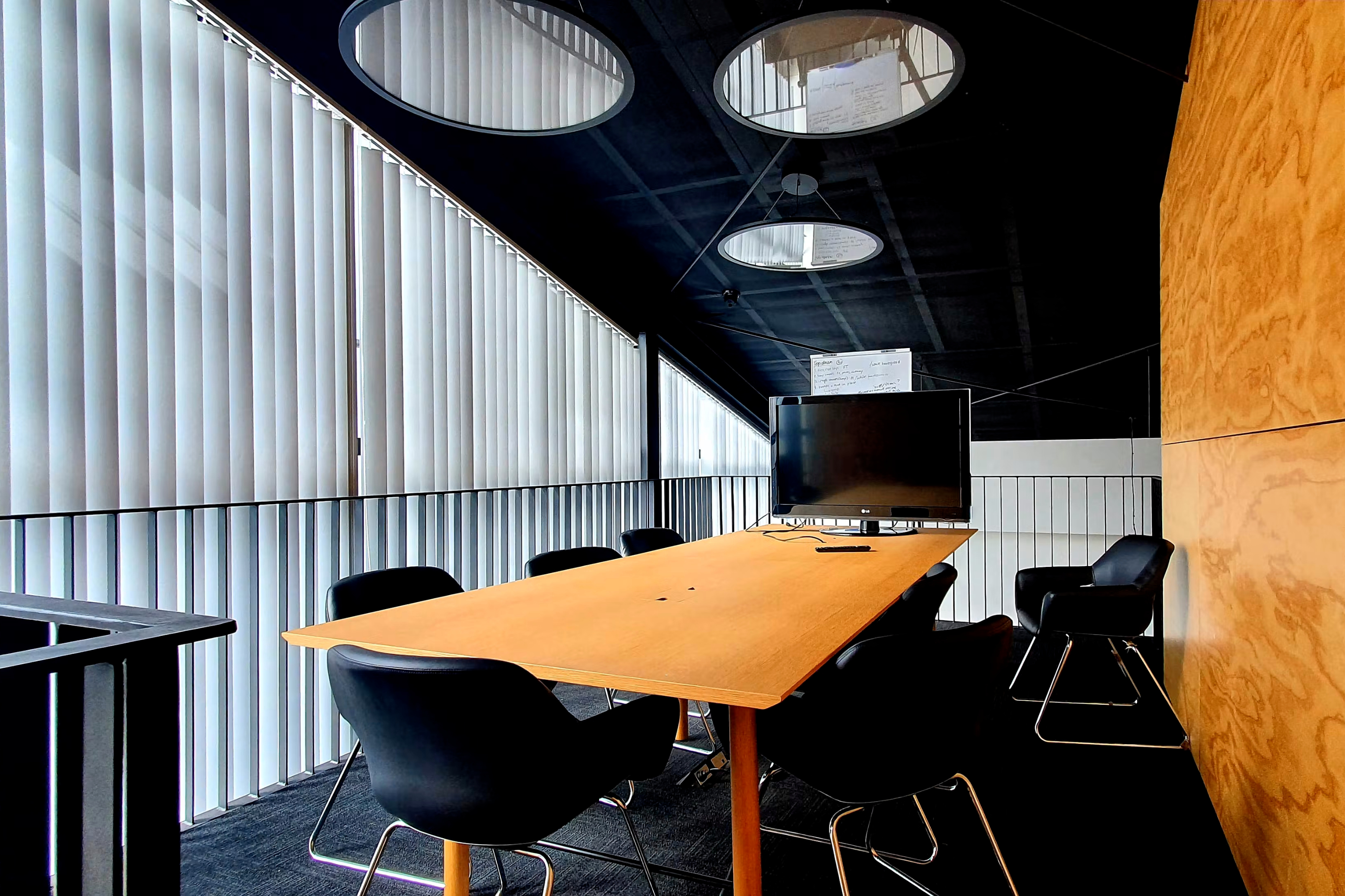 Vertical blinds in office boardroom