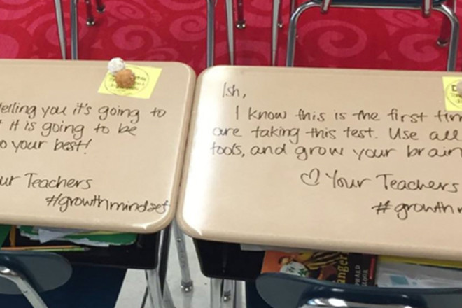 Teachers write good luck messages on pupils' exam desks 