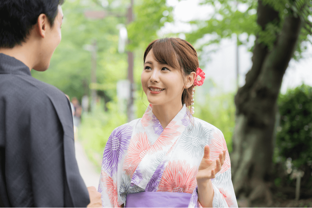 Japanese woman meets her date while wearing a yukata.