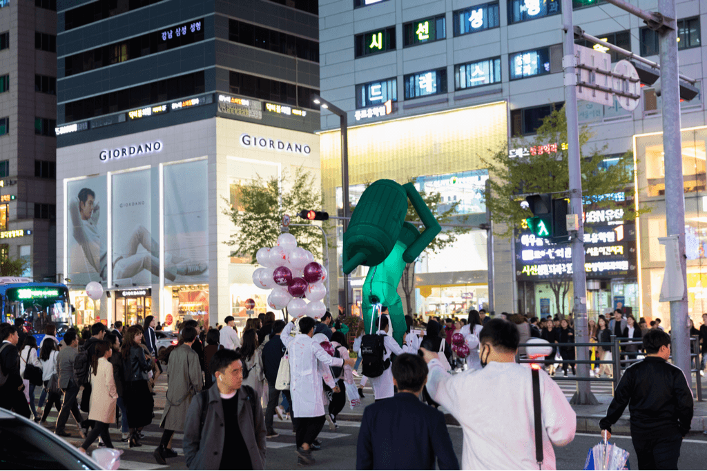 A street in Gangnam with many people enjoying shopping on the street