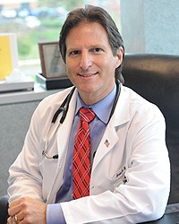 Headshot of Evan Siegel, rheumatologist