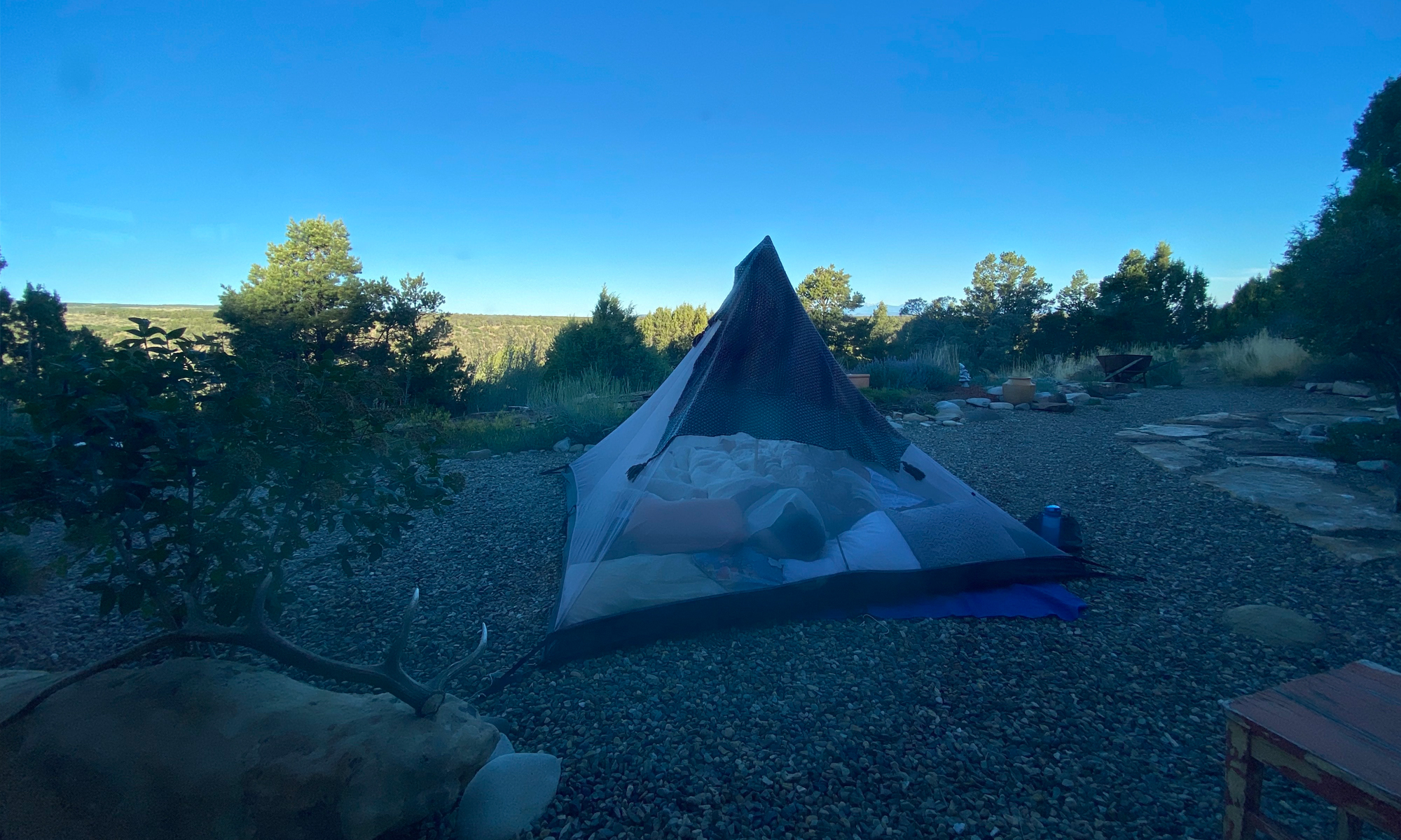 A tent set up in the wilderness