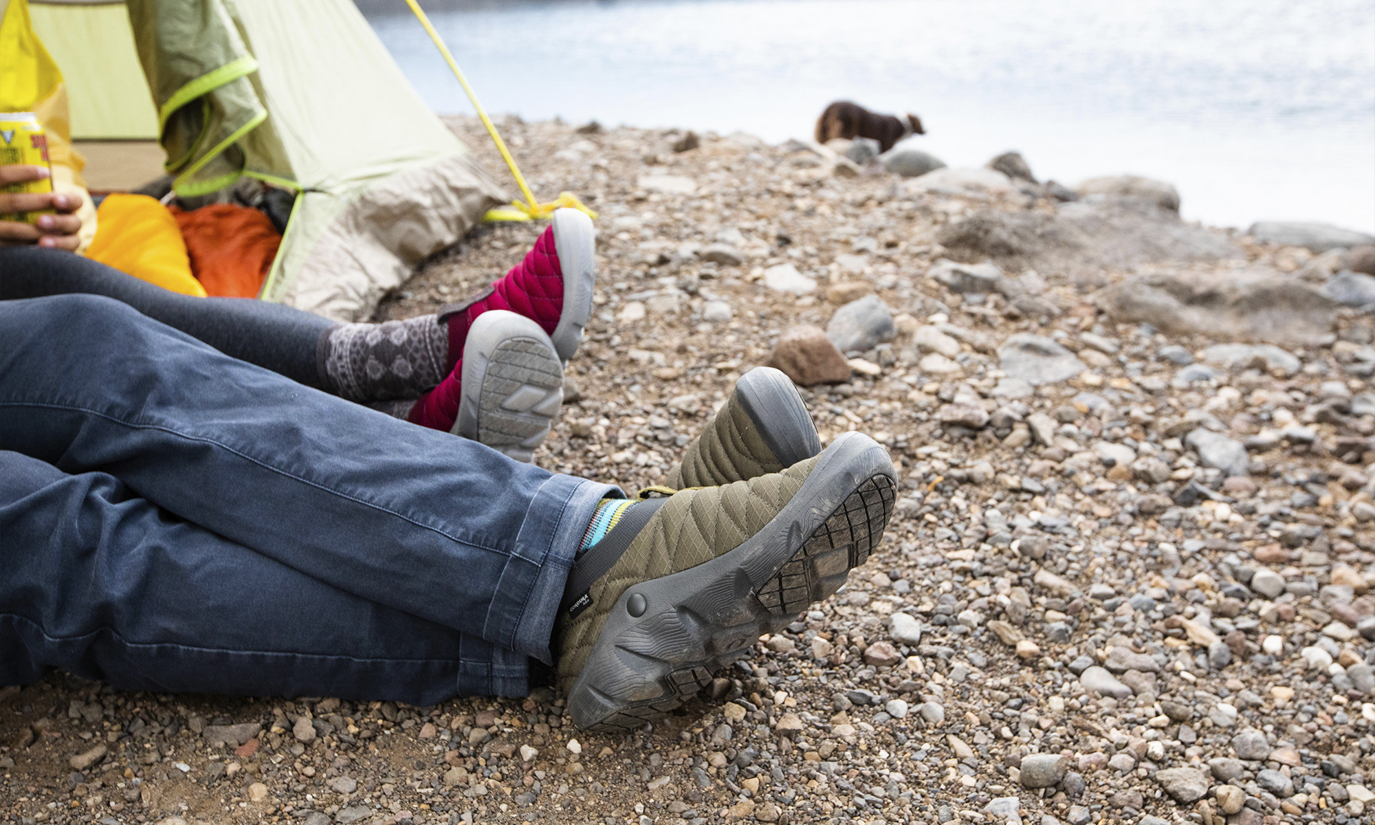 Two people in a tent at Hyalite lake wearing Oboz Whakata Puffy slippers.