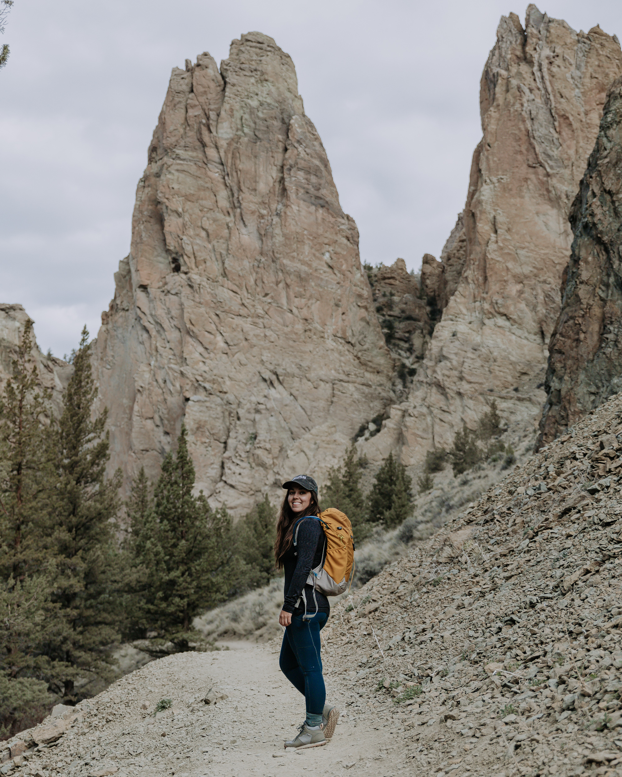 Lindsay Kagalis hiking in the Women's Bozeman Mid shoes surrounded by cool rock formations