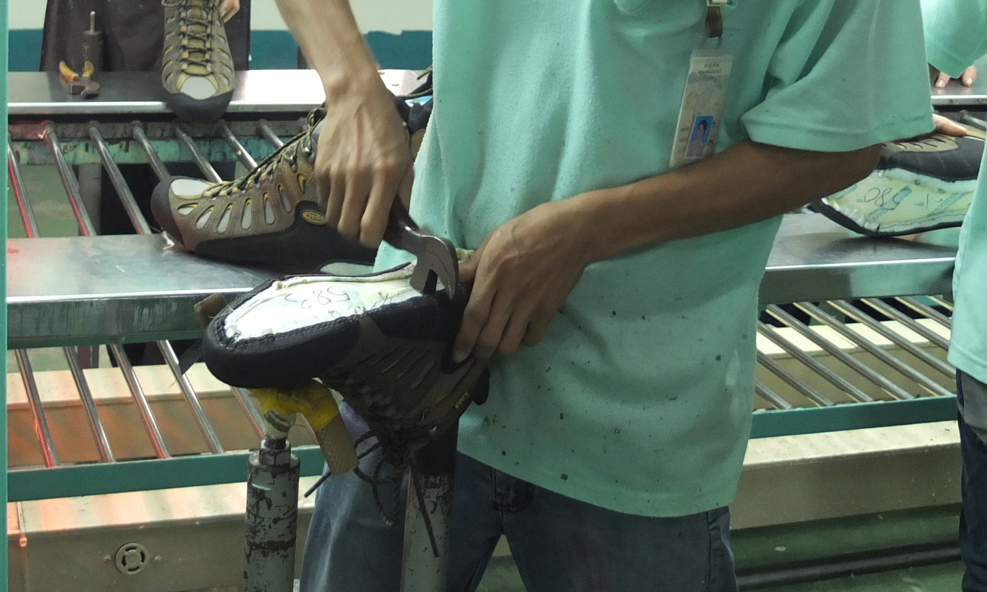 Oboz shoe employee constructing a shoe last in Vietnam.