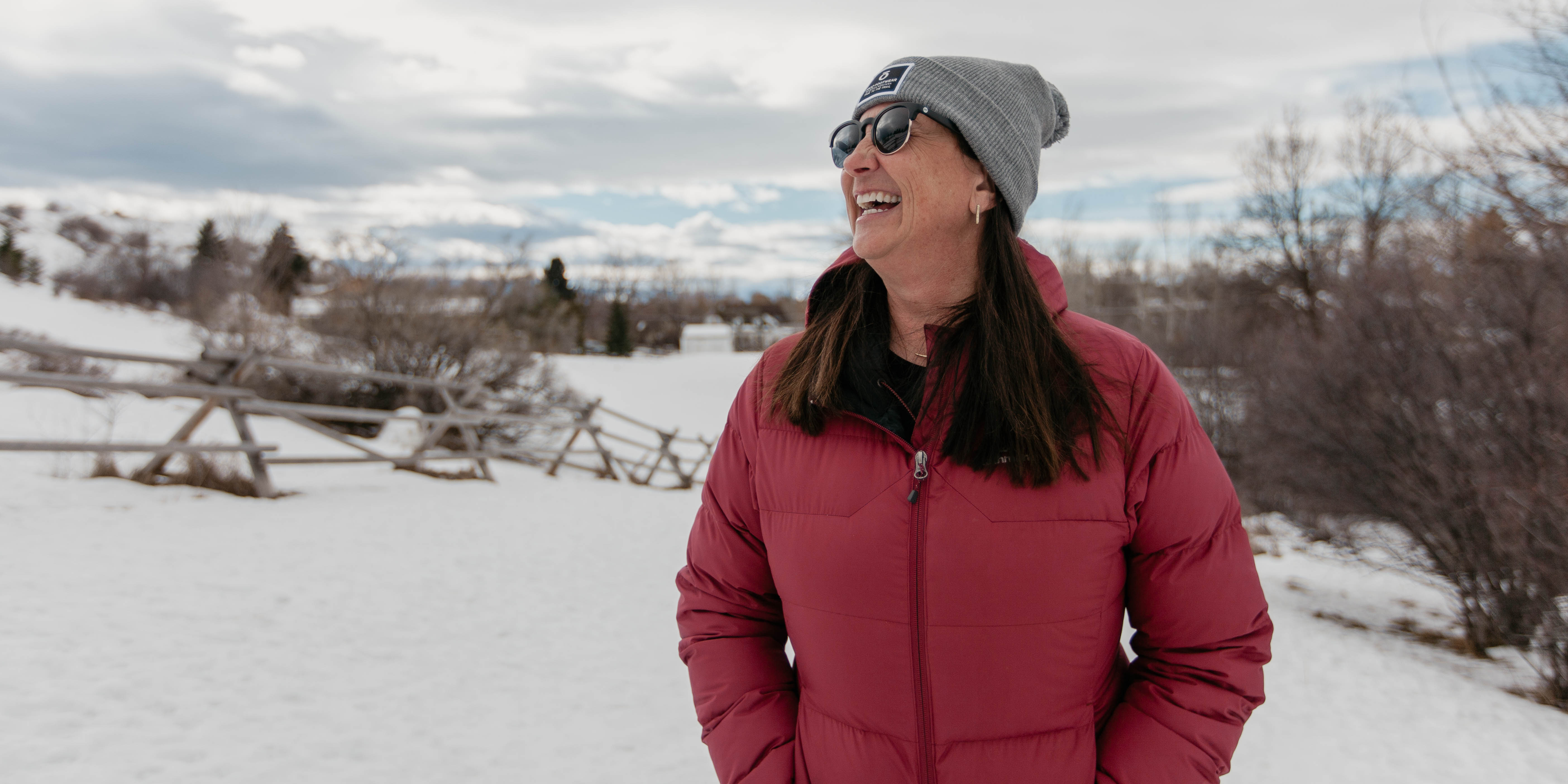 Oboz President Amy Beck smiling on a local Bozeman trail during the wintertime