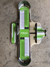 An Oboz branded Brannock device used to measure foot length, width, and arch length.