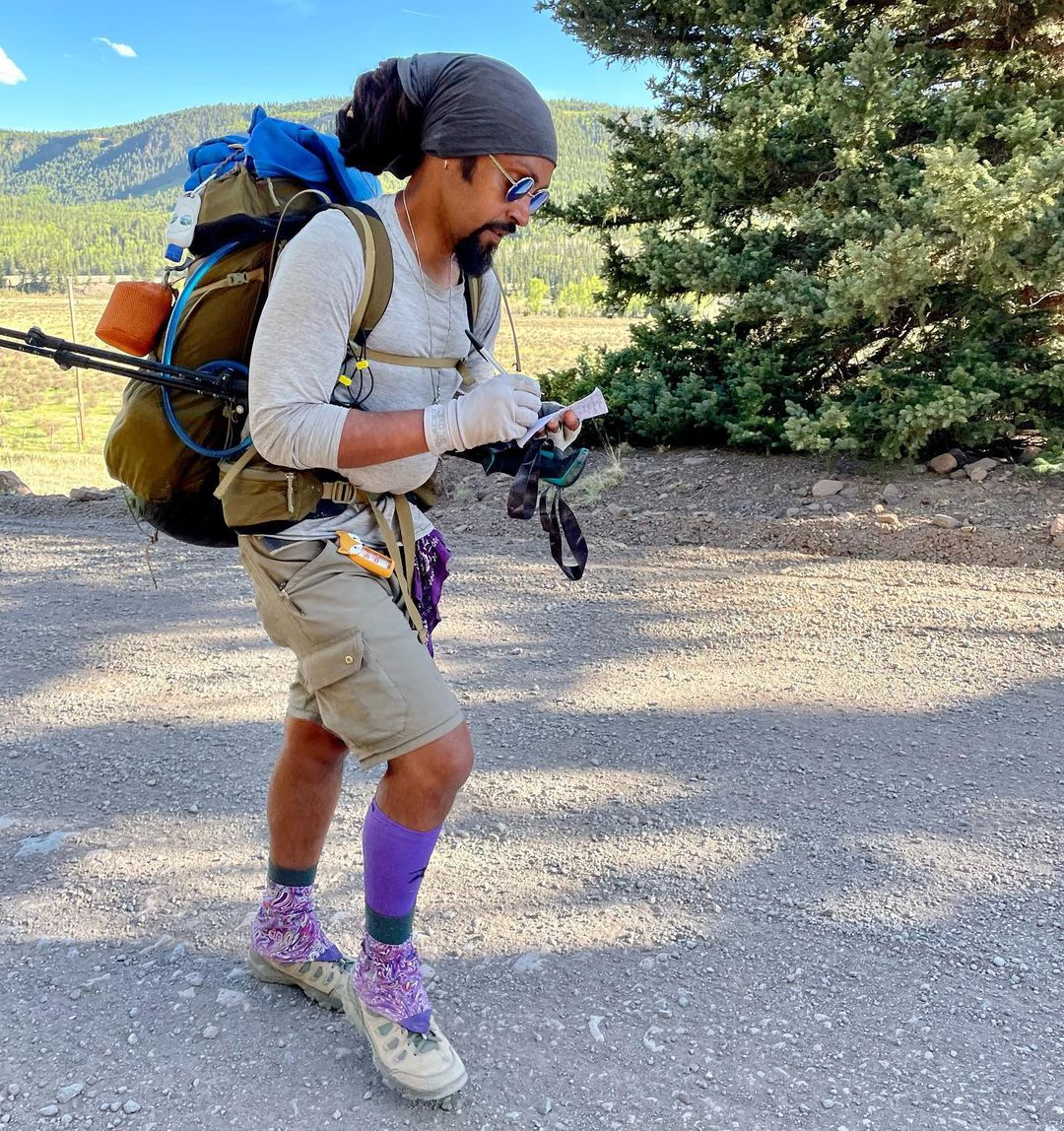 Derrick Lugo journaling while hiking the Continental Divide Trail.
