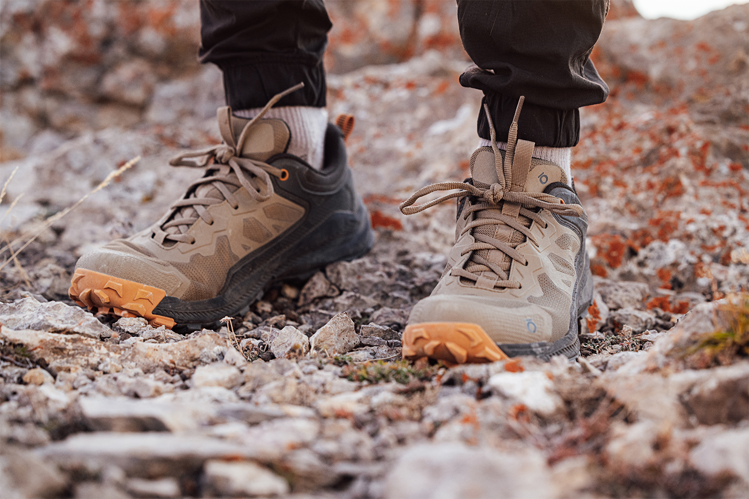 Closeup of the men's Oboz Katabatic Low hiking shoes on rocky terrain.
