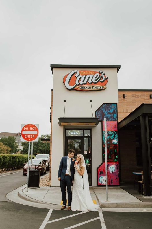 A couple enjoying Raising Cane's during their wedding day. 