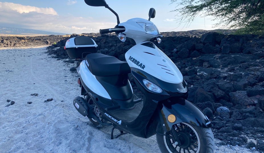Picture of an Ice Bear Rocket moped parked on a Hawaii beach