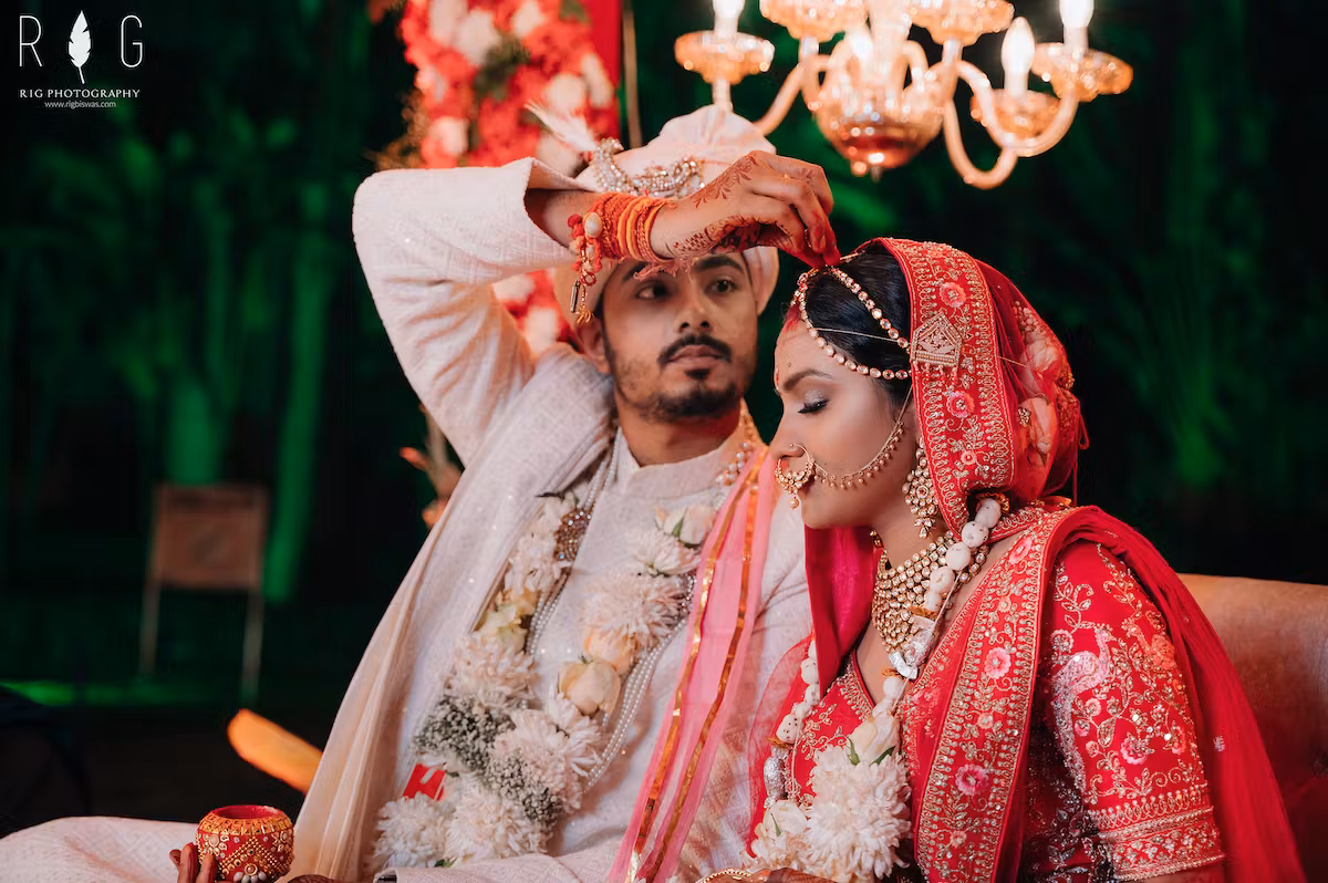 Pic of groom putting vermilion on bride's forehead