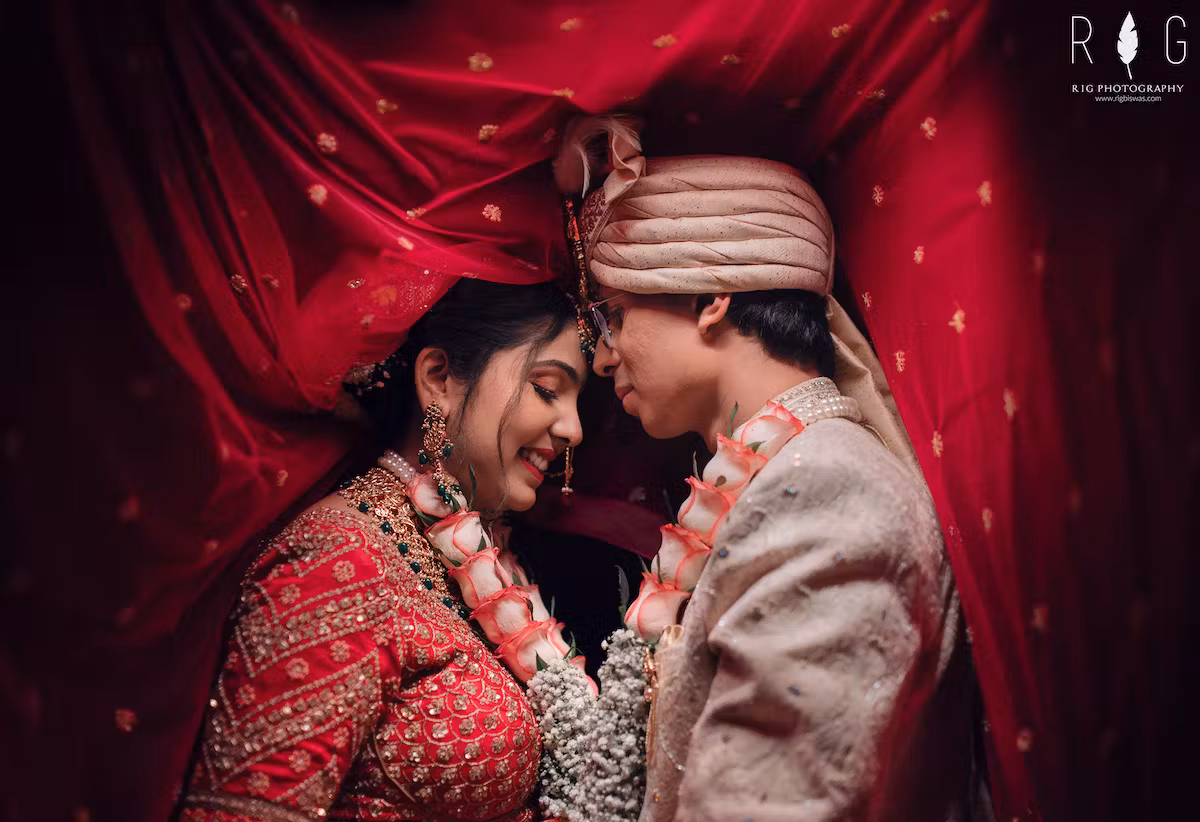Image of couple posing for a photograph after their wedding