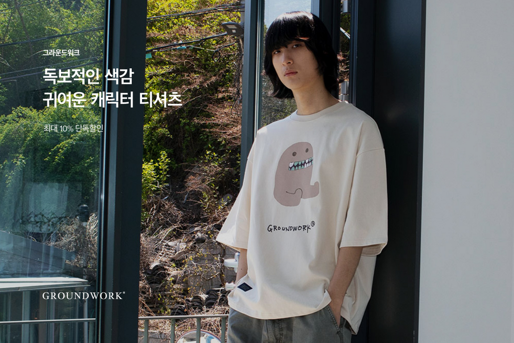 A man who wear cartoon pattern t-shirt from ÅLAND a multi-brand from Korea.