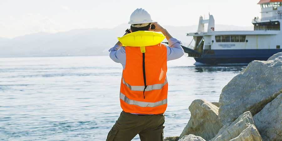 Dock worker with high-vis apparel.