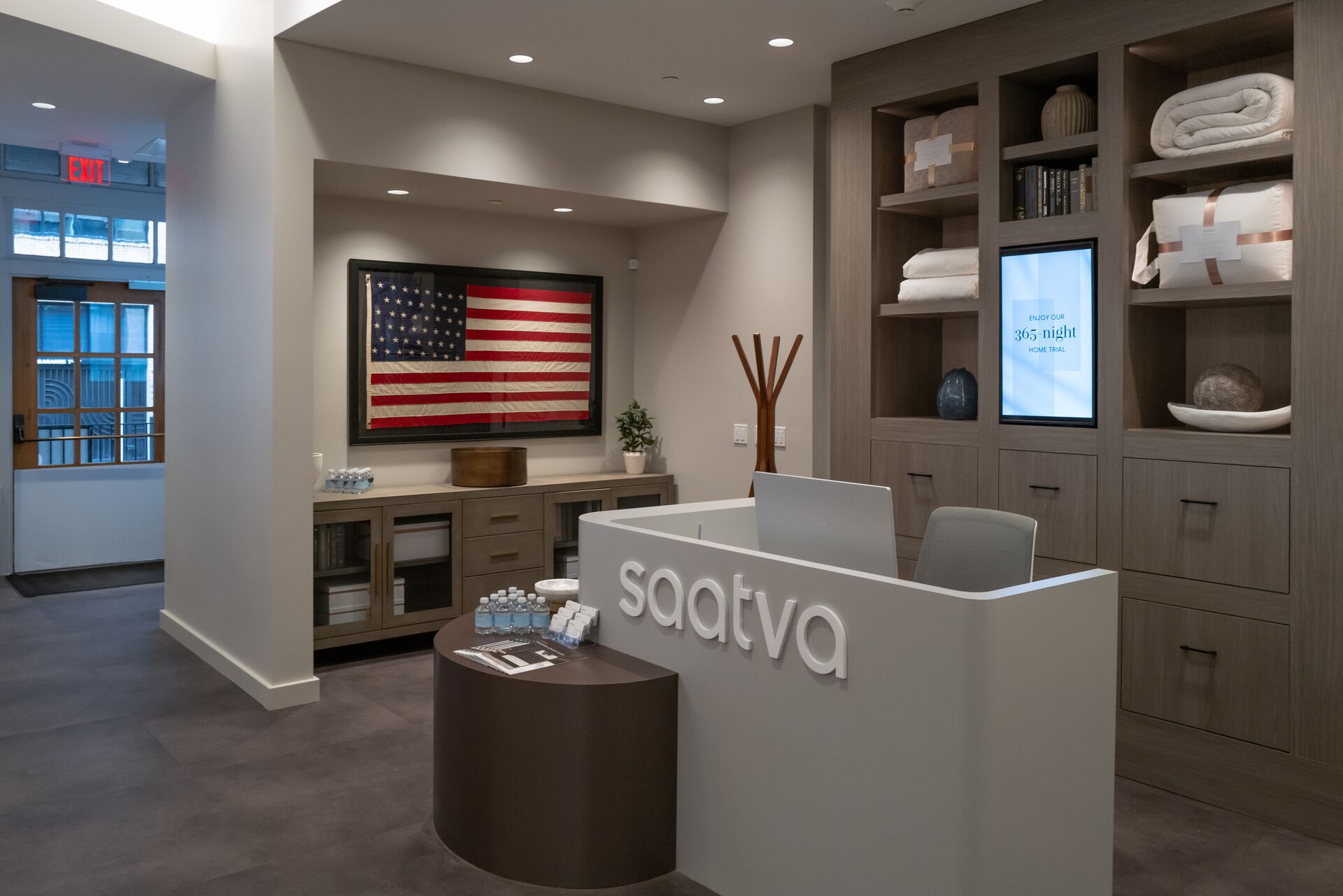 The welcome desk and historic American flag in the Saatva Portland Viewing Room.