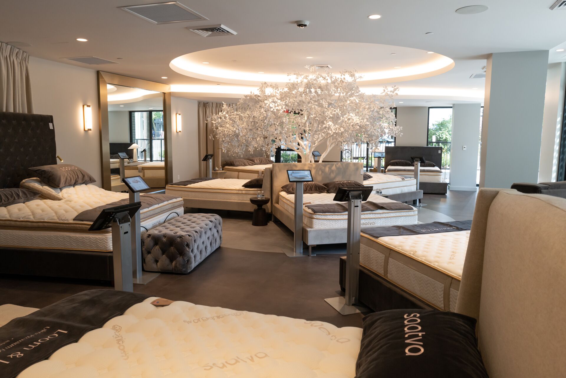 The elegant interior and mattress testing space in Saatva's modern and tranquil new University Village retail location.