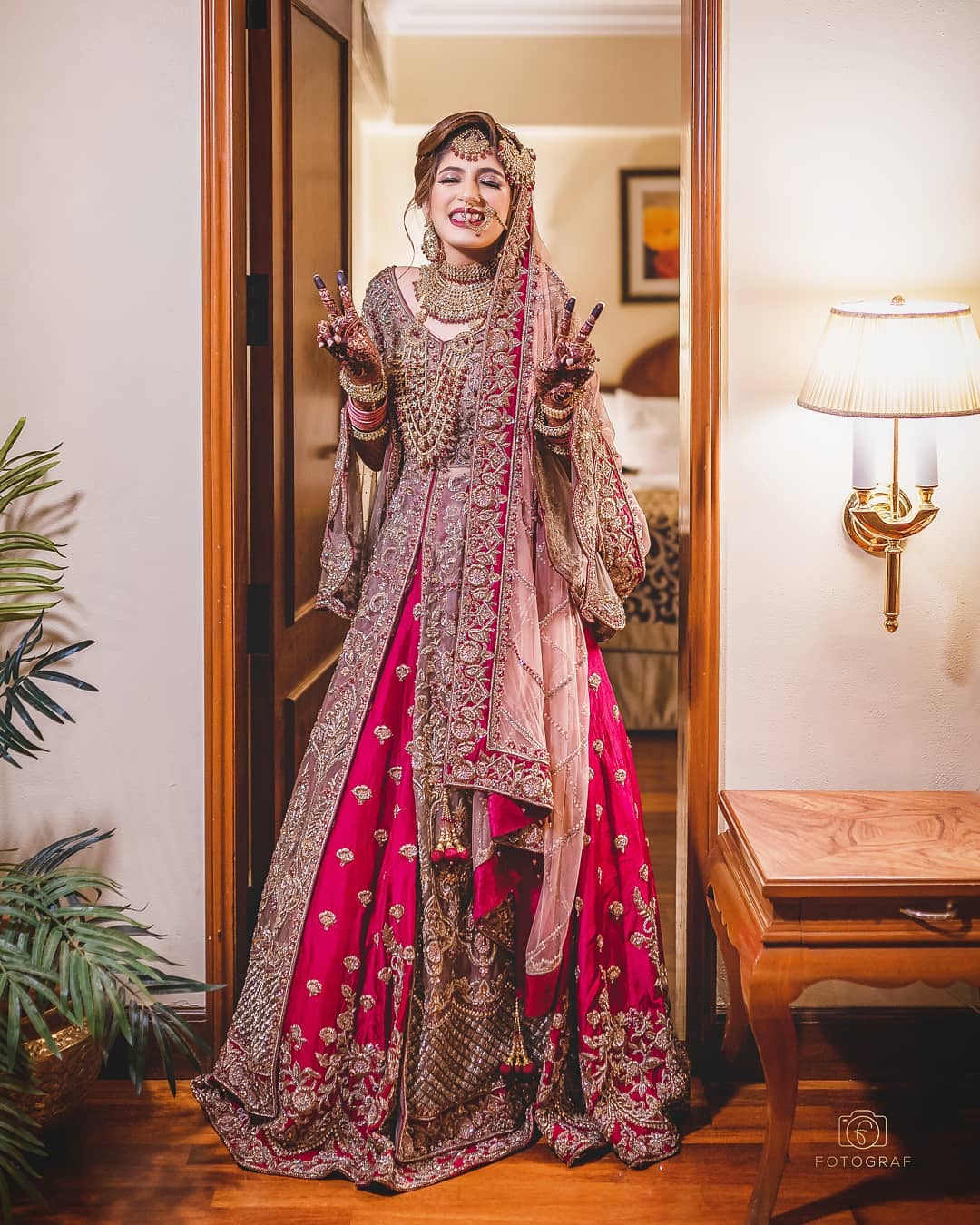 Stunning Indian Bride Dressed in Traditional Bridal Lehenga with Heavy Gold  Jewellery and Veil Smiles Tenderly in Studio Lighting Stock Image - Image  of girl, asian: 298322983