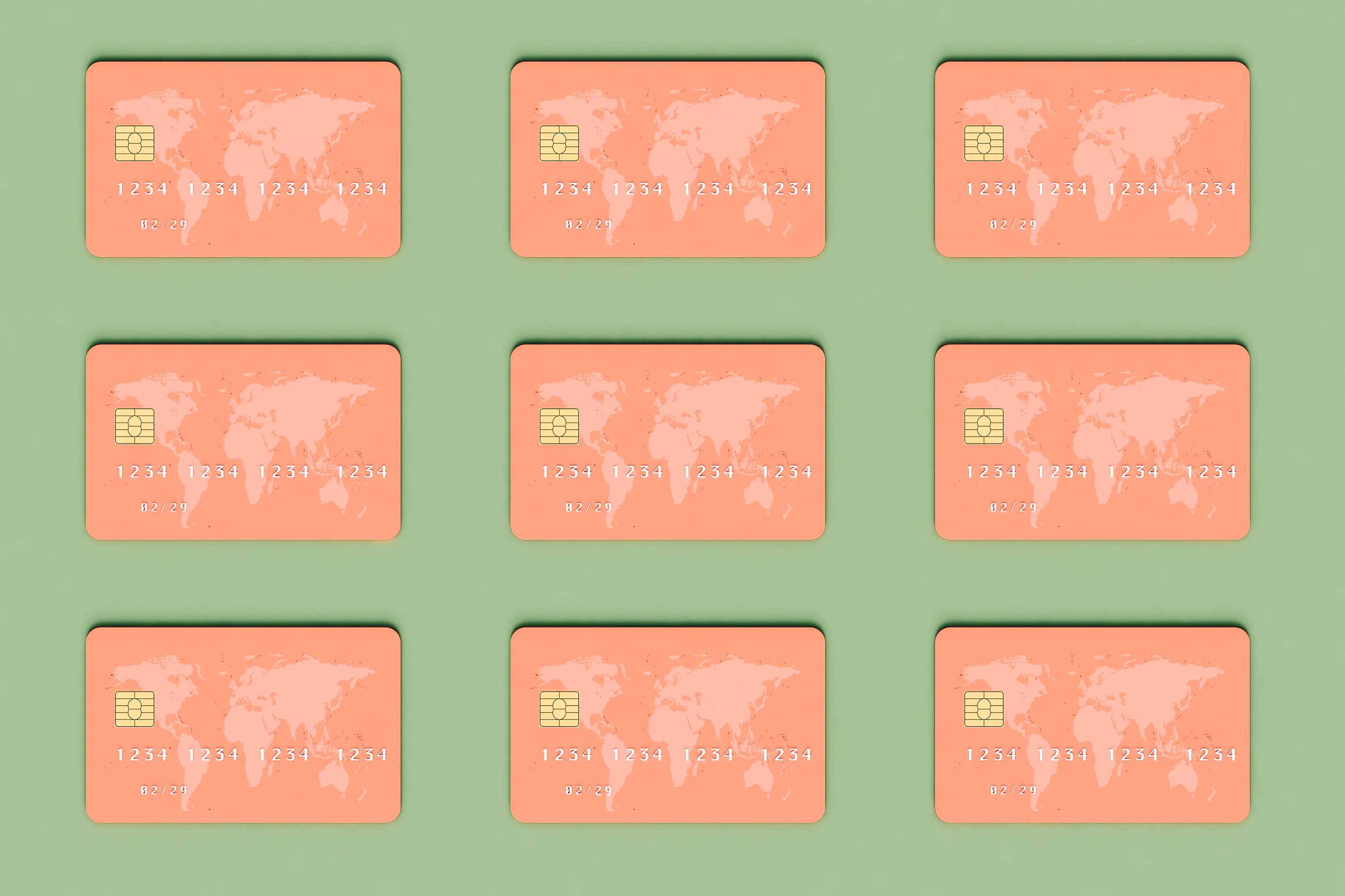 Nine orange credit cards with the picture of the world map arranged in a symmetrical grid against a light green background.