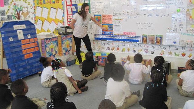 photograph of Daniela Silver teaching a group of students.