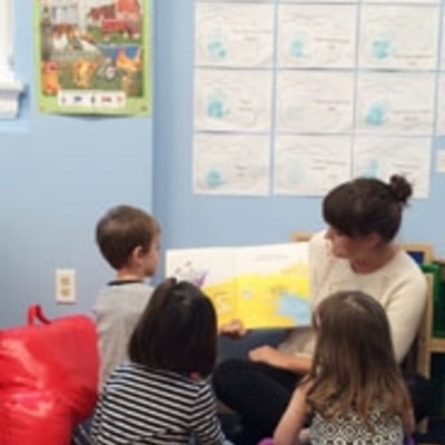 photograph of Emily Harden teaching students.