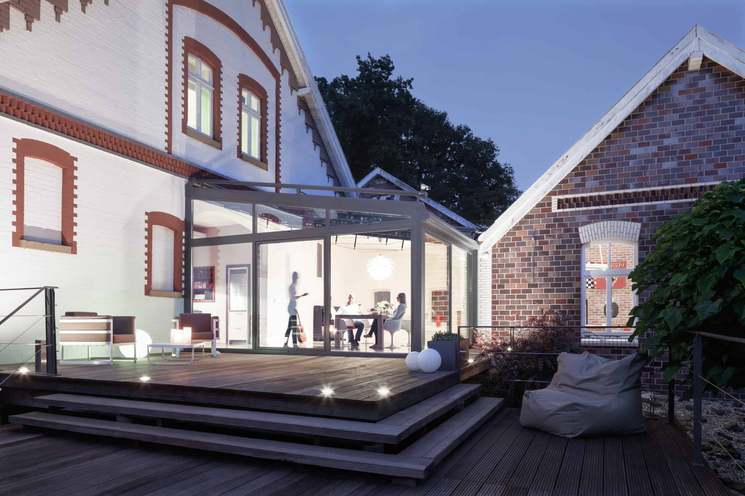Glass extension linking two buildings