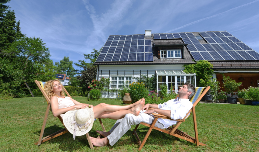 Couple chilling in front of large residential solar array