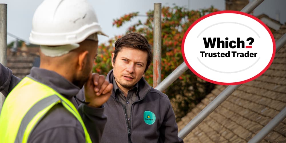 Sunsave installers talking on a roof with Which Trusted Trader logo