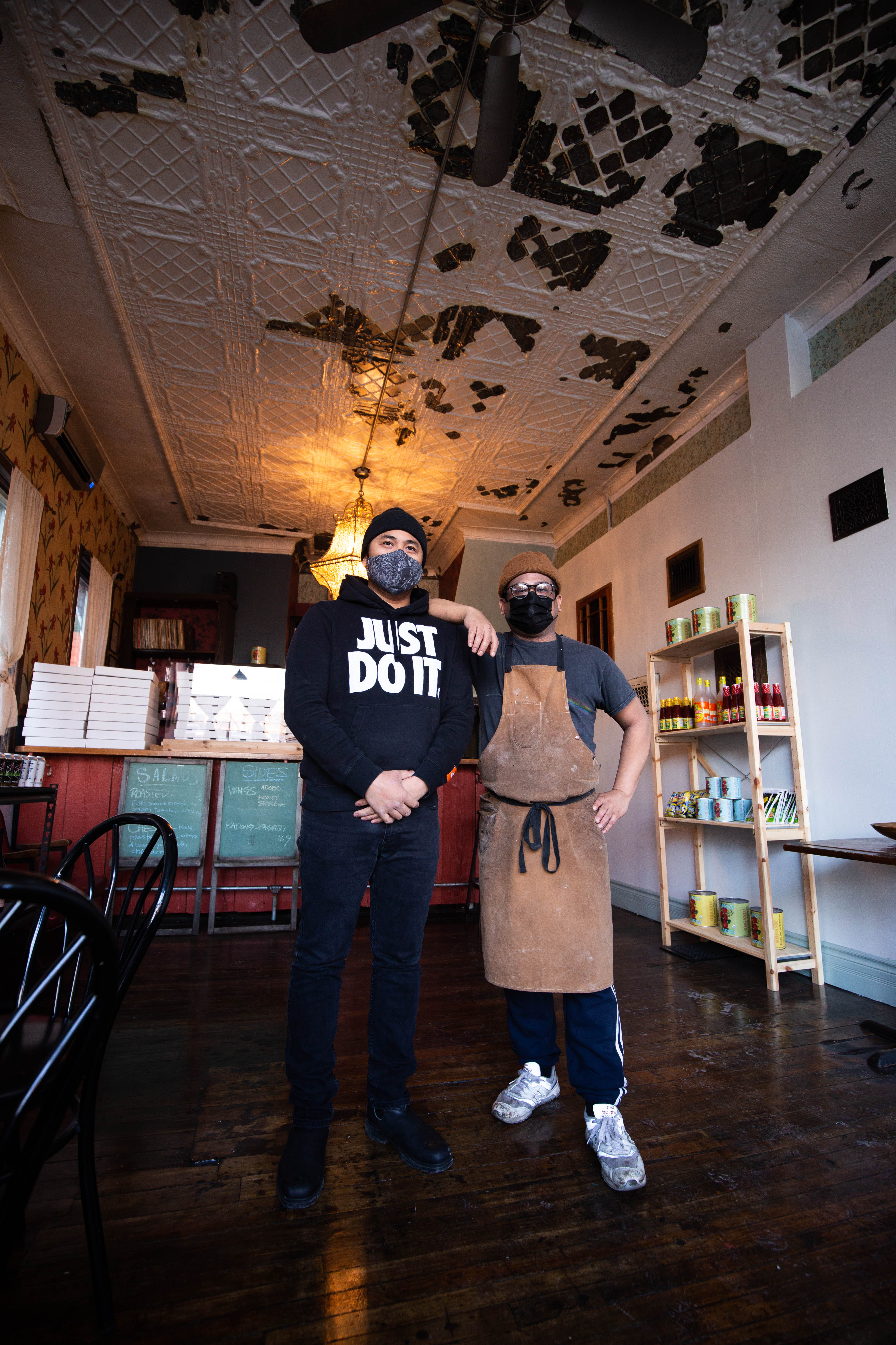 Chuck Ortiz (left) and Sean Santos (right) stand in the dining room of Saints Island Pies.