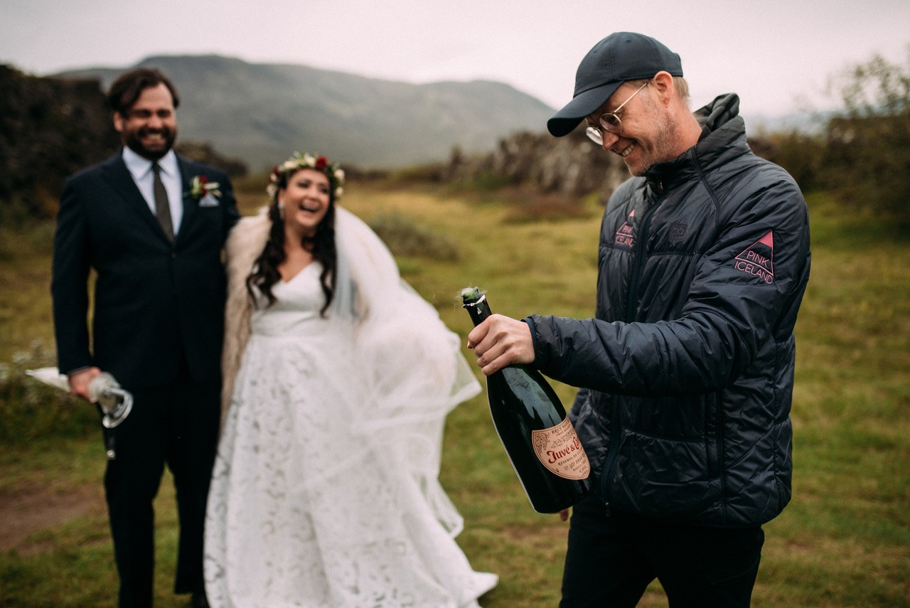Pink Iceland co-owner Hannes opens champagne bottle for newly-wed couple