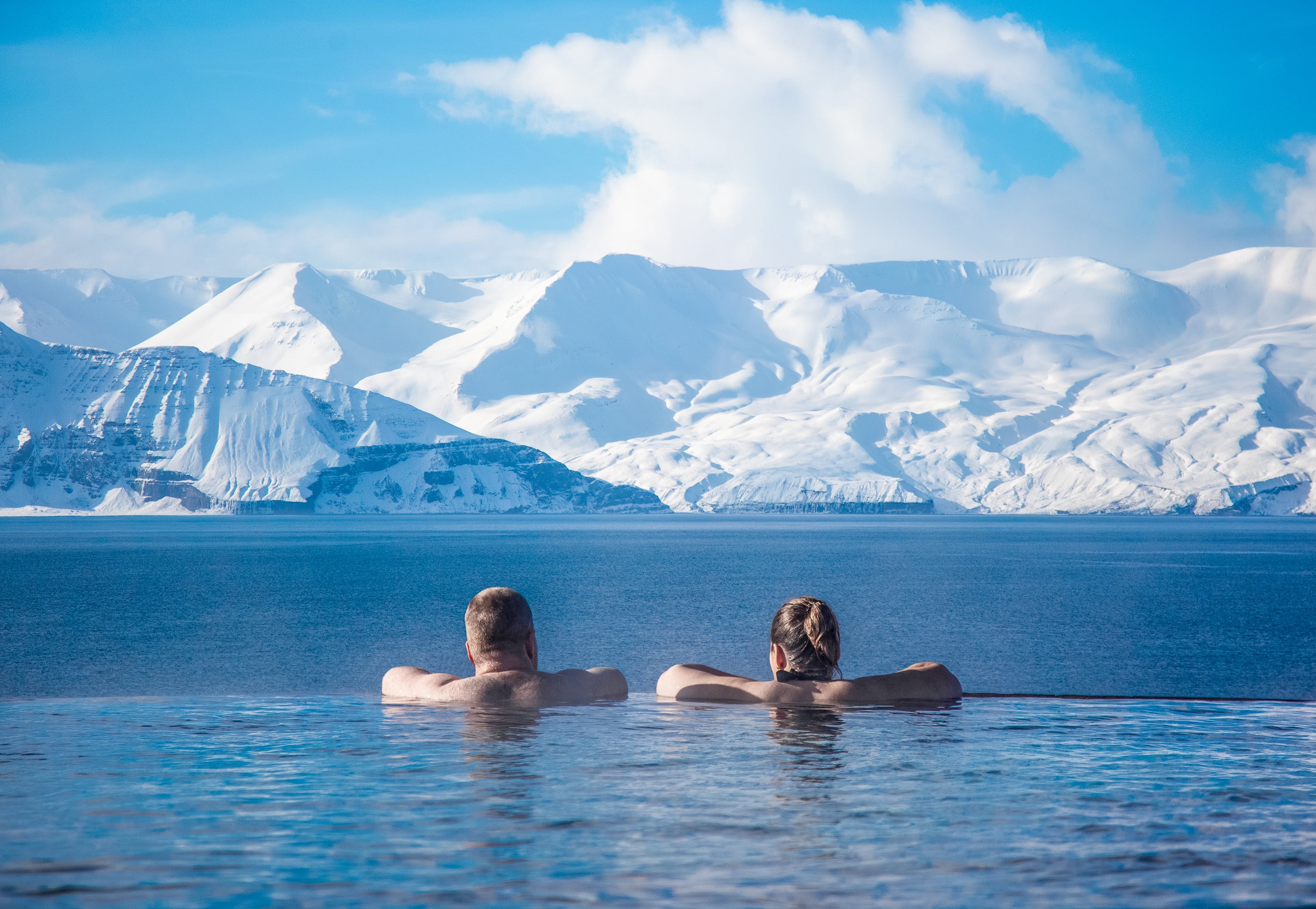 People bathing in Geosea with a mountain view