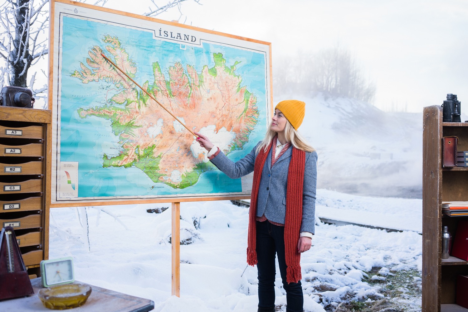 A woman pointing at a map of Iceland